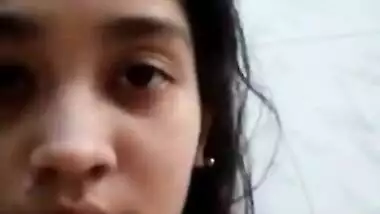 Indian teen turns on touching tits and shoves fingers into pussy