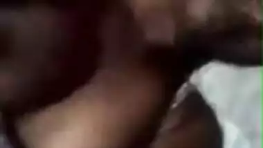 Tanned Desi girl lies in bed stripping XXX boobies for old pervert