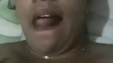 Indian aunty with sexy full lips takes big natural boobs out in bed