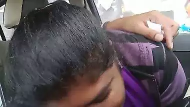 Telugu woman gives a desi blowjob to her man in a car